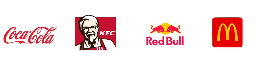 Logos from left to right: Coca-Cola in red script, KFC with Colonel Sanders illustration, Red Bull with two red bulls and a yellow sun, McDonald's with a yellow "M" on a red background.